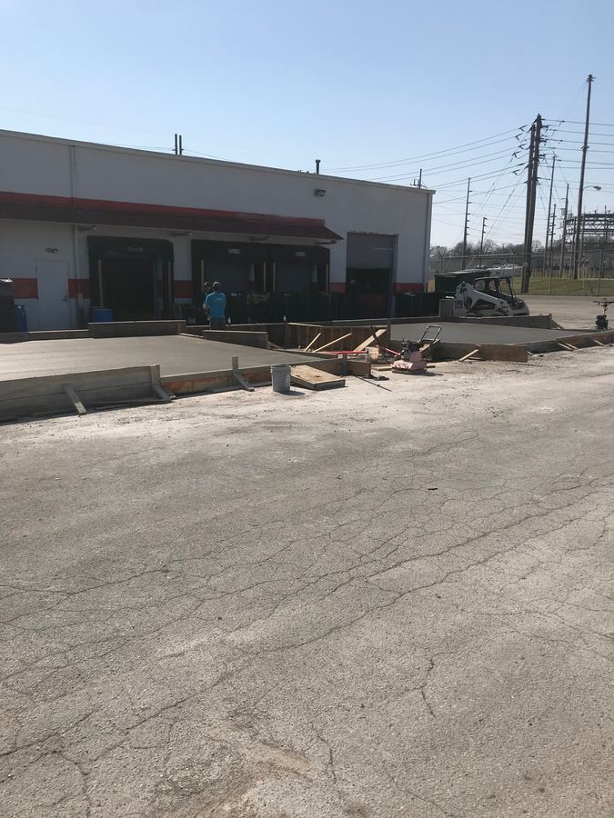 Commercial building addition with new concrete pad