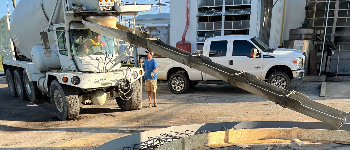 Jason Smith Construction team on a job site directing a concrete pour